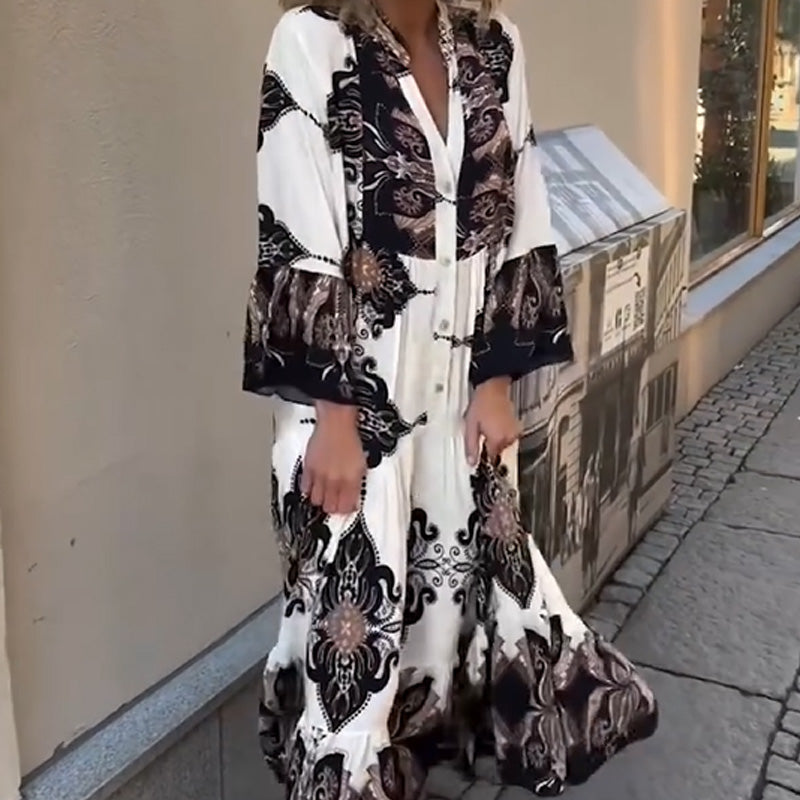 Anirelle - Elegant women's dress with a loose, flowing print, V-neck, and flared sleeves